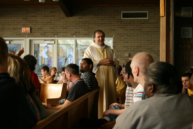 Fr. Enzo and residents in SLC Chapel